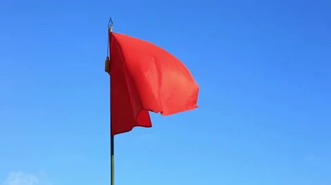 Red flag flapping in blue sky Stock Footage 59343333
