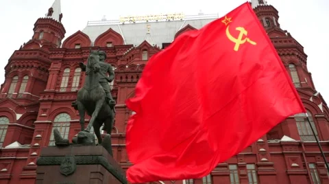 Red flag flutte in front of historical museum on Manezhnaya Square. Stock Footage