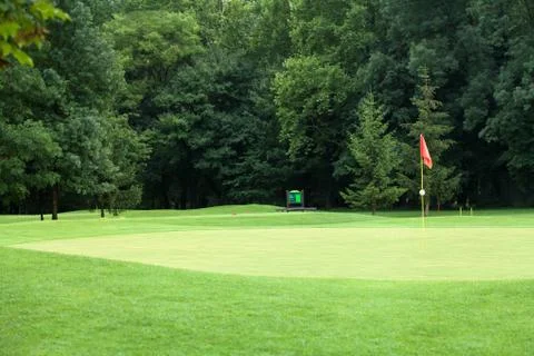 Red flag on a golf course Stock Photos