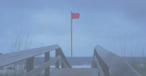 Red flag at Gulf Shores beach, dusk Stock Footage 38392853