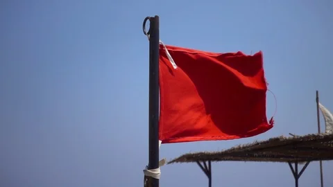 Red flag over blue sky slow motion, 240 fps (8x), hd 1080p video footage Stock Footage 84171748