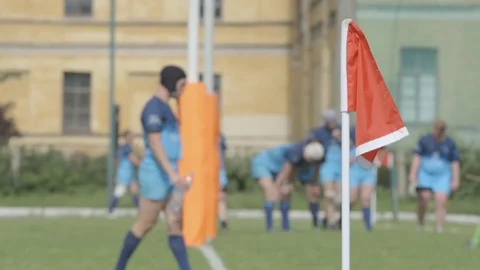 Red flag on a play field and rugby players - Slow Motion Stock Footage 80863493