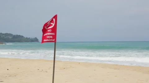 Red flag prohibiting swimming due to the storm and undercurrents Video stock 63467538