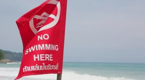 Red flag prohibiting swimming due to the storm and undercurrents Stock-Footage 63469002