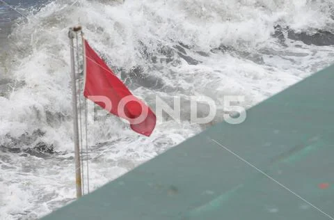Red flag of sea big danger Stock Photos