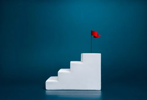 Red flag on top steps of white staircase as bar graph chart steps, isolated.. Stock Photos
