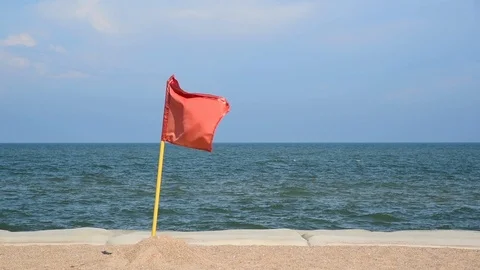 Red flag warning on the beach Stock Footage 96337164