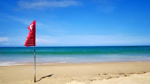 Red flag warning on the beach. To say that the danger of swimming in the sea  Vidéo 79868338