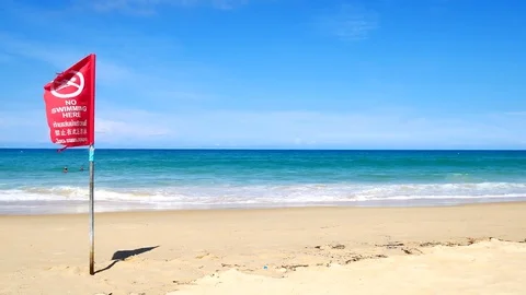 Red flag warning on the beach. To say that the danger of swimming in the sea  Stock Footage 79868369
