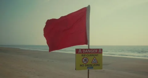 Red Flag Warning on Beach Signaling Dangerous Rip Currents 스톡 동영상 325685672