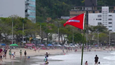 Red flag warns of dangerous conditions at Atalaia beach, Itajai, Brazil Stock Footage 329077326