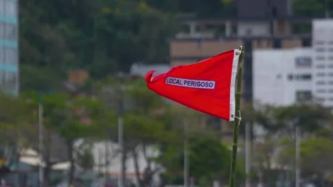 Red flag warns of dangerous conditions at Atalaia beach, Itajai, Brazil Stock Footage 329077331