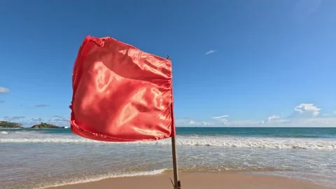 Red flag waving on tropical beach in Indian Ocean Sri Lanka Stock Footage 339901762