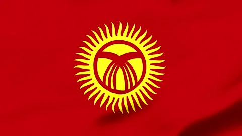 Red flag with yellow sun and traditional Kyrgyz symbol in center Vídeos de archivo 343317379