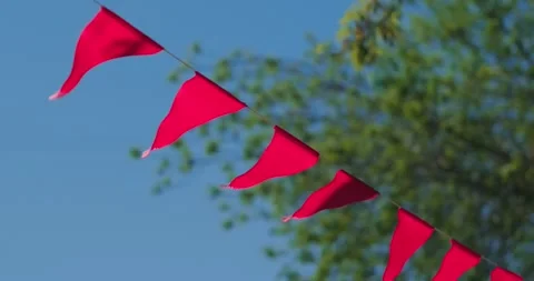Red flags against the sky Video stock 241774580