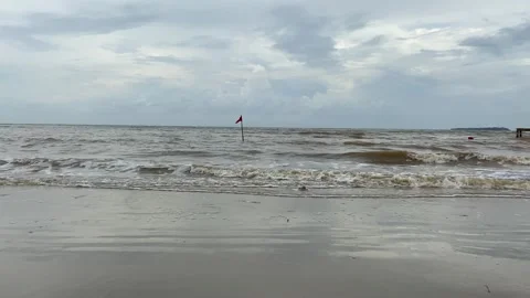 Red flags on the beach Stock Footage 294851548