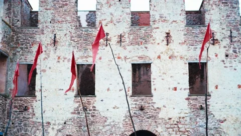 Red flags in front of an ancient castle. Stock Footage 219029909