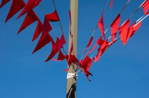 Red flags or banners on a pole Stock Photos
