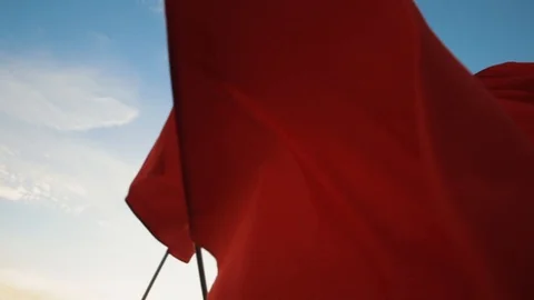 Red flags is waving against blue sky. Stock Footage 103700867