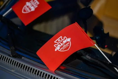 Red Flags on windshield with Logo of the Belgrade Grand Prix 2024 show of v.. Stock Photos