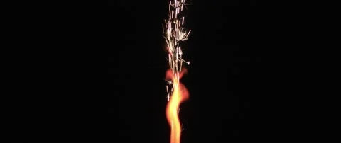 Red flame and sparks coming out of a firework in slow motion. Stock Footage 132965452