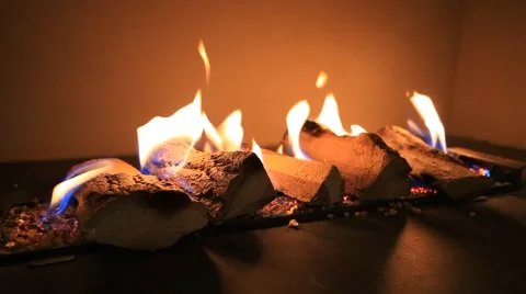 Red flame on artificial logs in the stove Video stock 40053701