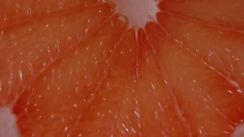 Red flesh of grapefruit in macro, variable lighting. 스톡 동영상 263141096