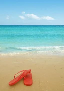 Red flip flops on the beach Stock-Fotos