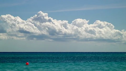 Red Float, Big Clouds, and Wet Horizon Stock Footage 92503915