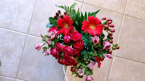 Red flower bouquet on turntable Stock Footage 92945945