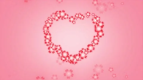 Red flowers in a big heart shape formation, pink background Stock Footage 134517699
