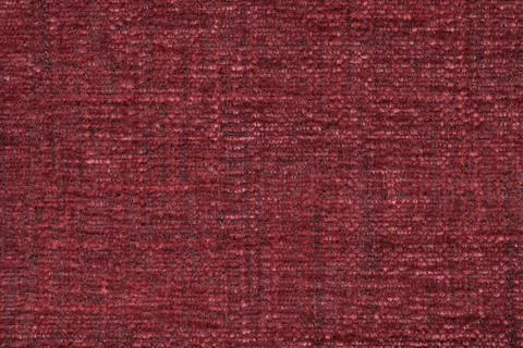 Red fluffy background of soft, fleecy cloth. Texture of textile closeup Stock Photos