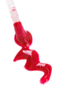 Red fluid lips gloss stroke with brush, isolated on white Foto stock