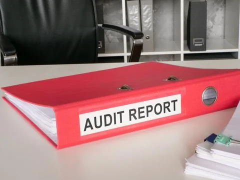 A red folder with audit report. 스톡 사진