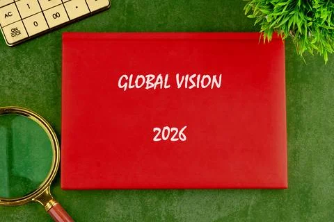 Red folder with Global Vision 2026 rests on a green surface next to a calculator Stock Photos