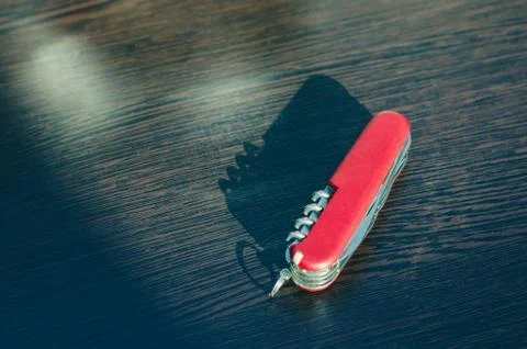 Red folding multifunctional knife Stock Photos