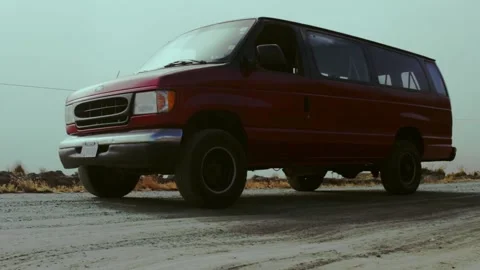 Red Ford Van driving on a bumpy street in La Cumbre, Bolivia Stock Footage 158027178