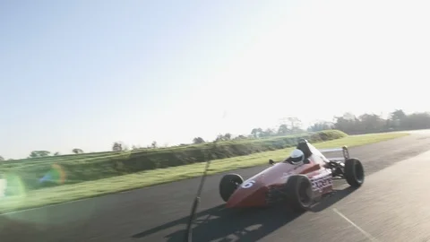Red Formula 1 one car drive on pro race circuit Video stock 127419025