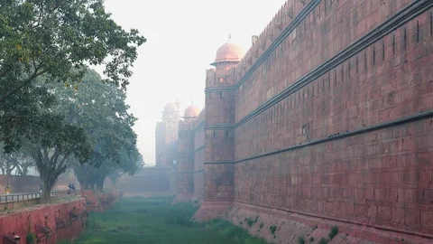 Red fort walls viewed through early morning haze in old delhi Stock Footage 111754471