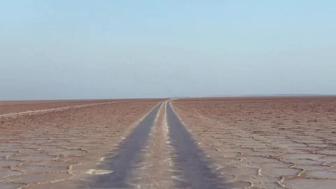 Red four wheel drive passing the salt lake on sunrise tc02 Stock-Footage 102223703