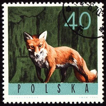 Red fox on post stamp Stock Photos