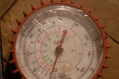 Red freon manometer close up. Stock Photos