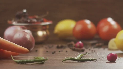 Red fresh cabbage falls on table with drops in slow motion Stock Footage 124725132