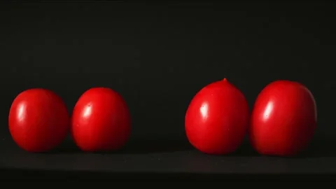 Red fresh tomatoes on a black background Stock Footage 133421156