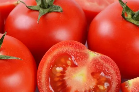 The red fresh tomatoes cut. macro 스톡 사진