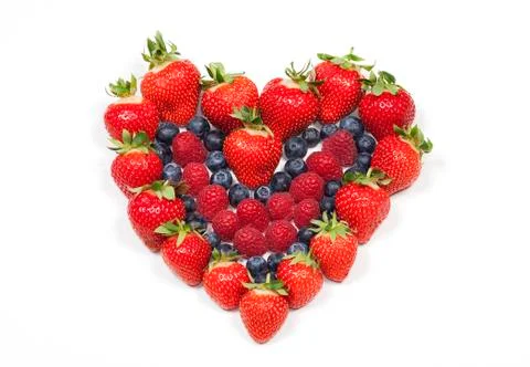 Red fruit heart on white background Stock Photos