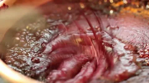 Red fruit marmalade in copper pot mixing Stock Footage 11404074