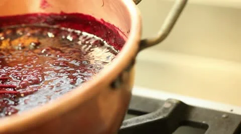 Red fruit marmalade in copper pot pan left Stock Footage 11404096
