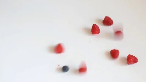 Red fruits falling from above Видео 76982804