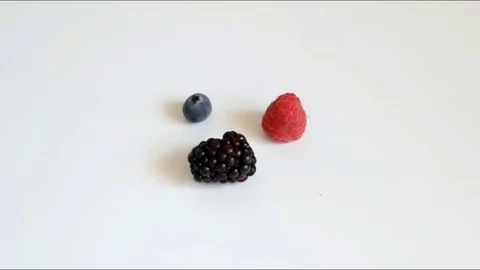 Red fruits on white background Stock Footage